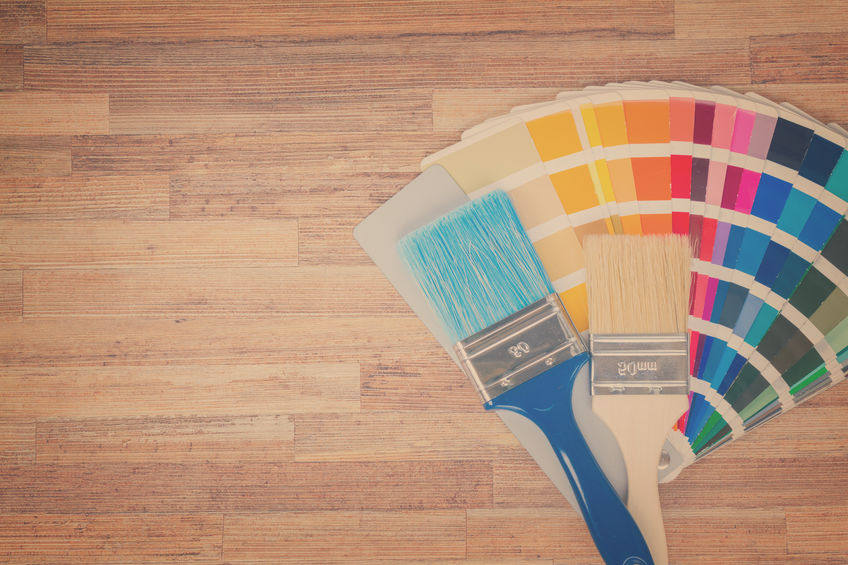 Color palette guide and brushes on wooden background with copy space, retro toned