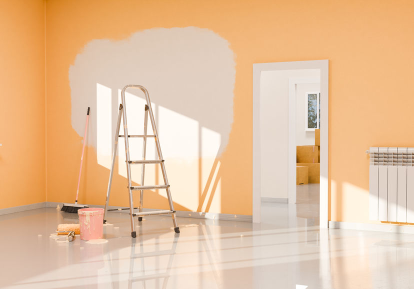 3D rendering of a room with orange walls during a renovation, with a white unpainted patch, a ladder, a bucket of paint and a roller, with sunlight coming through the window.